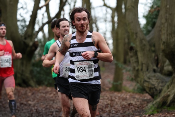 London running club athlete competing at cross country event