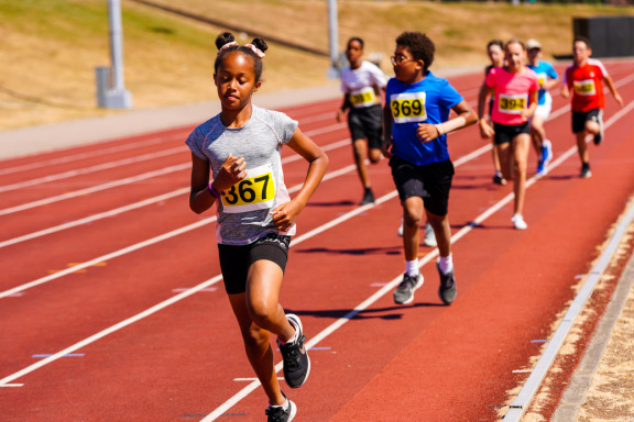 Children running on local track